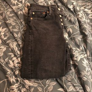 High-waisted black Levi’s